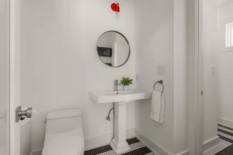 a view of a house with a yard and sitting area