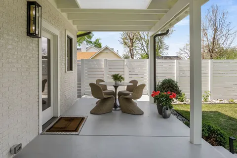 a view of an empty room and wooden floor