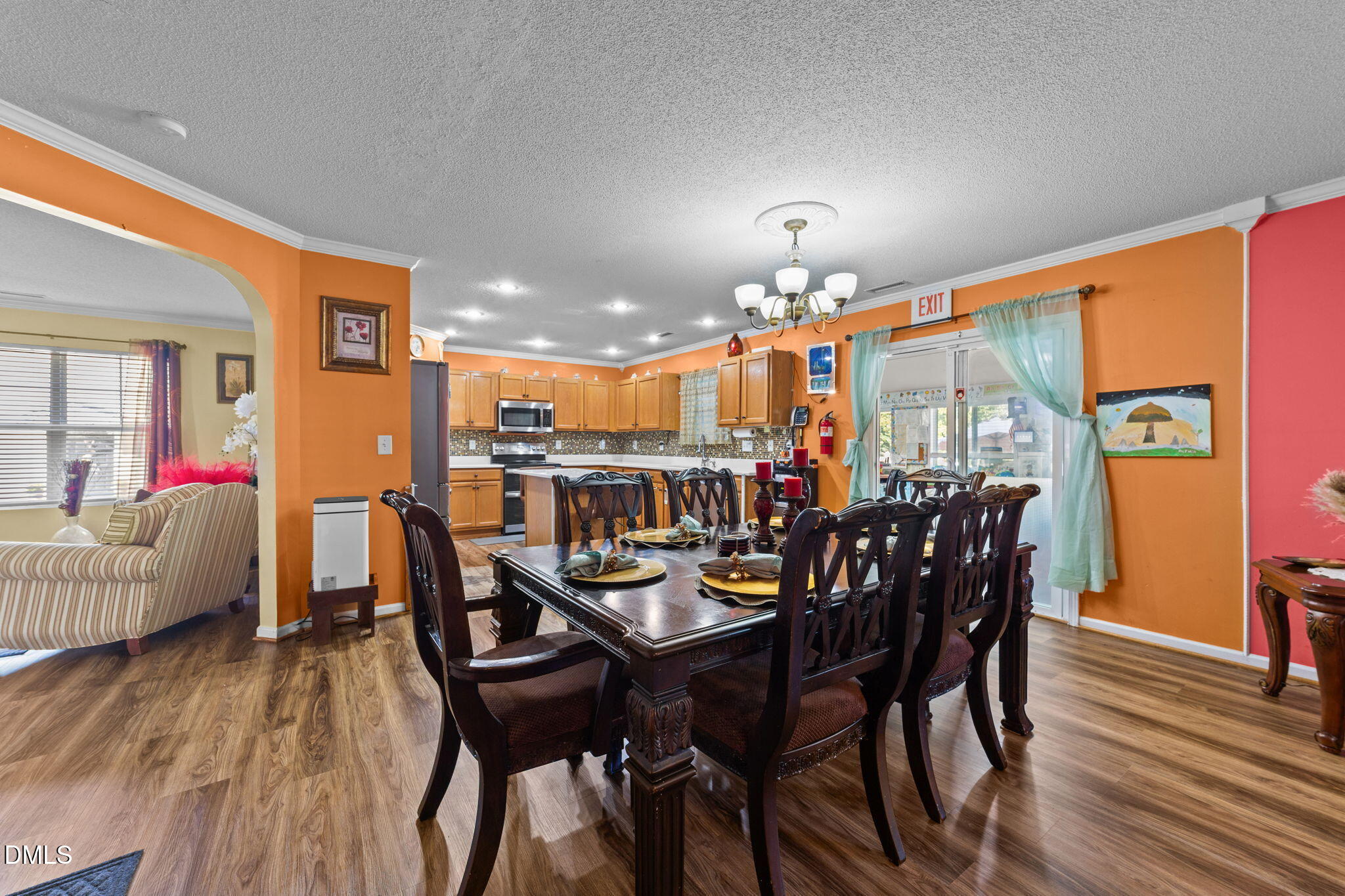 135 Oakton Ridge Place Garner, NC 27529 - Photo 12 of 40 a view of a dining room with furniture and wooden floor