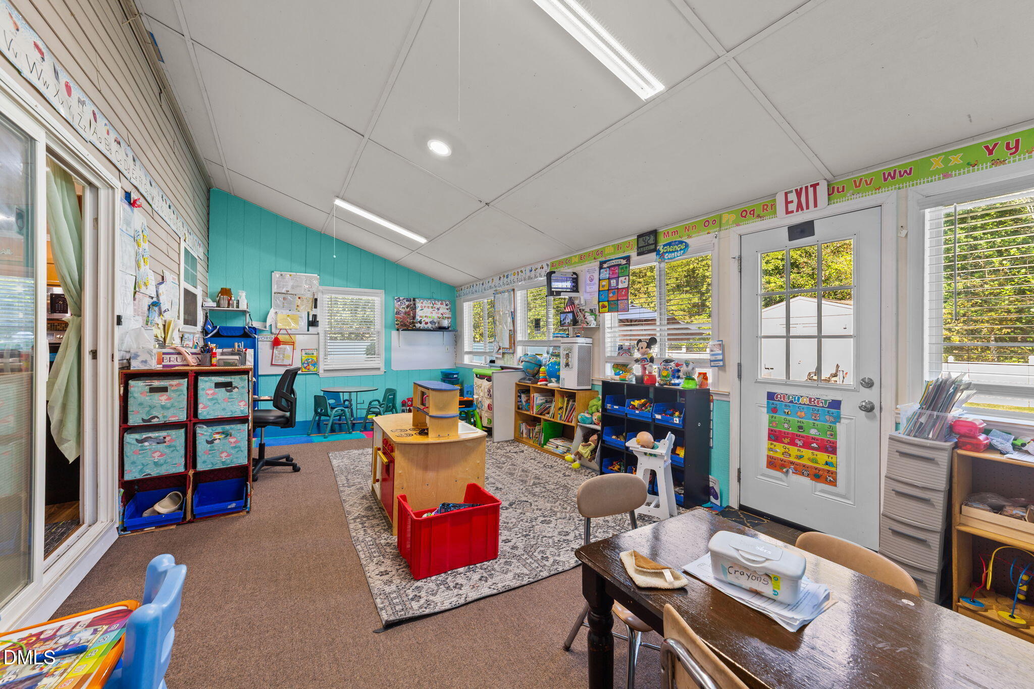 135 Oakton Ridge Place Garner, NC 27529 - Photo 18 of 40 a living room with lots of furniture and toys