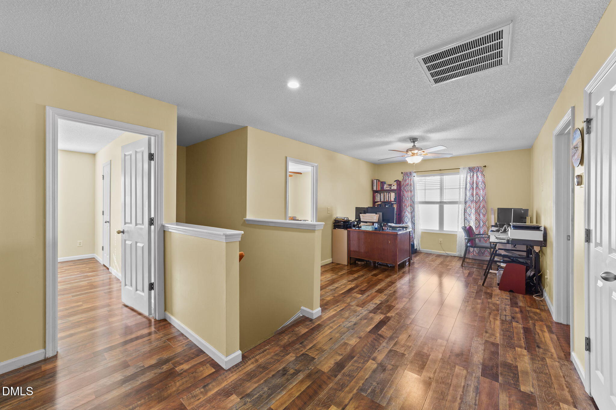 135 Oakton Ridge Place Garner, NC 27529 - Photo 19 of 40 a living room with furniture and a wooden floor