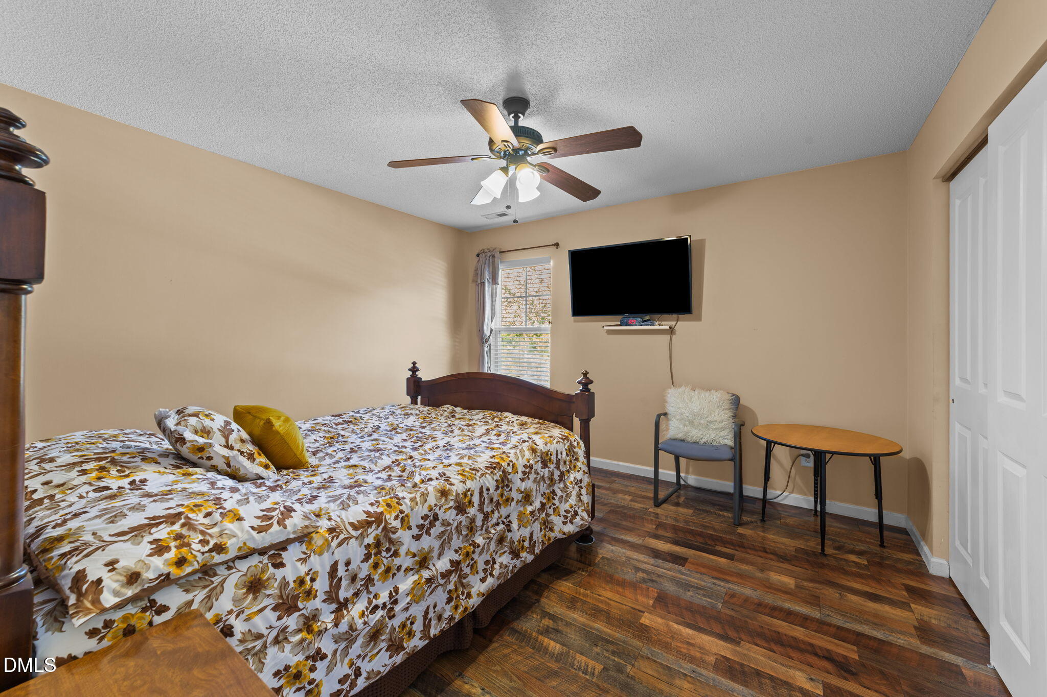 135 Oakton Ridge Place Garner, NC 27529 - Photo 20 of 40 a bedroom with a bed and a flat screen tv