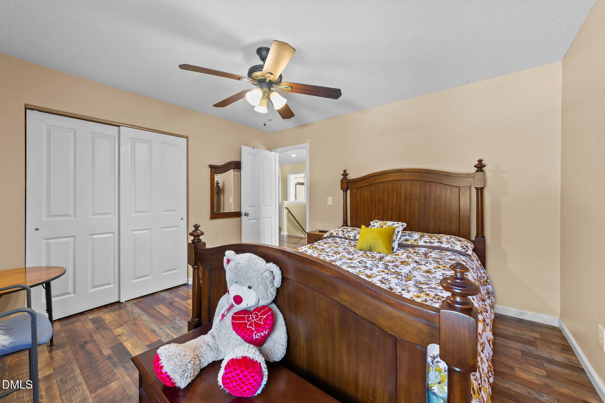 135 Oakton Ridge Place Garner, NC 27529 - Photo 21 of 40 a bedroom with a bed and a chandelier