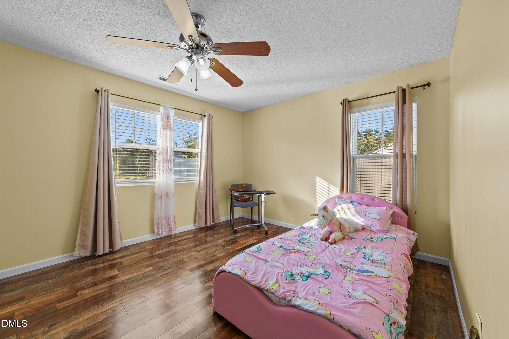 135 Oakton Ridge Place Garner, NC 27529 - Photo 22 of 40 a bedroom with a bed and a window