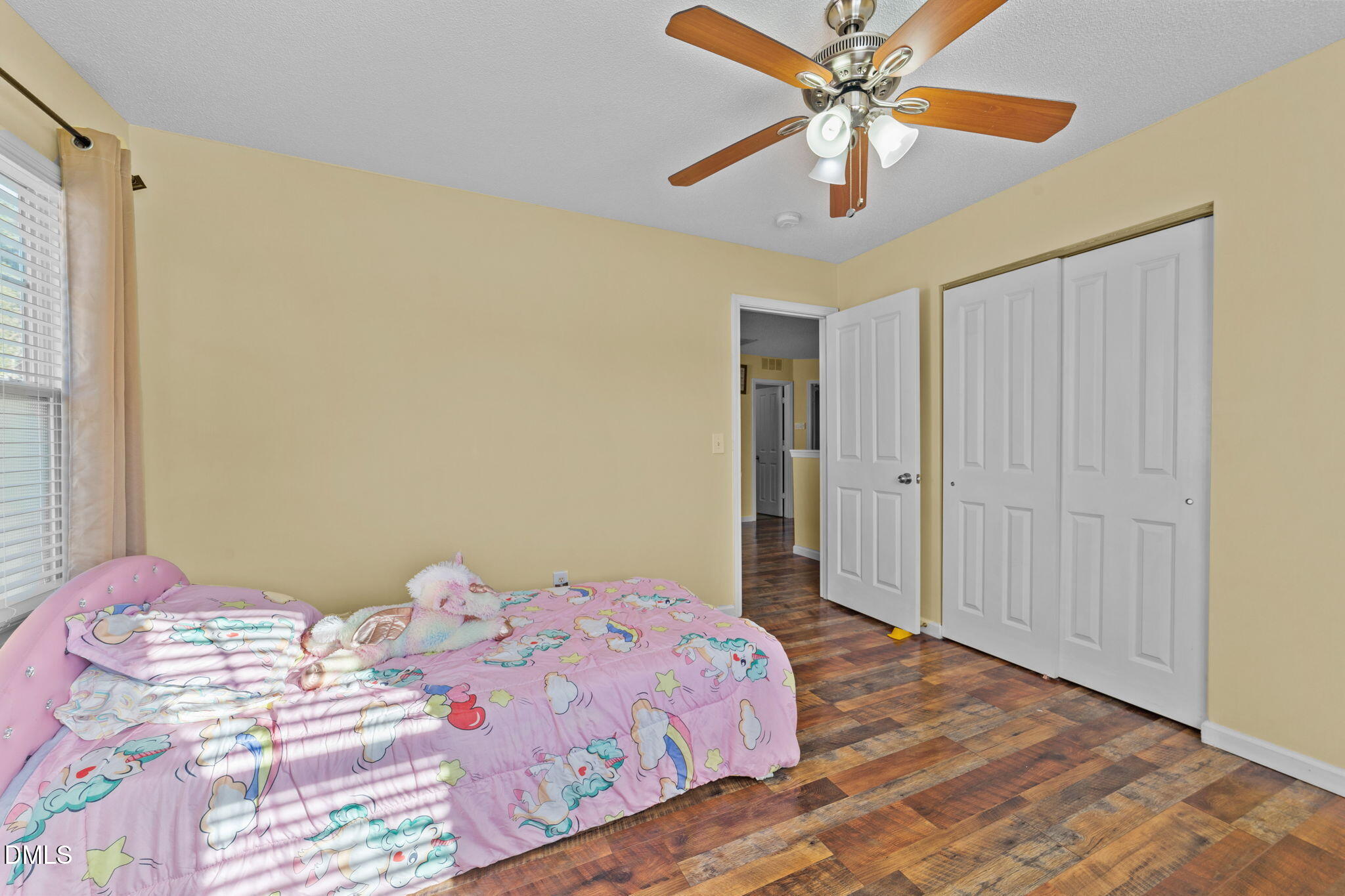 135 Oakton Ridge Place Garner, NC 27529 - Photo 23 of 40 a bedroom with a bed and a chandelier