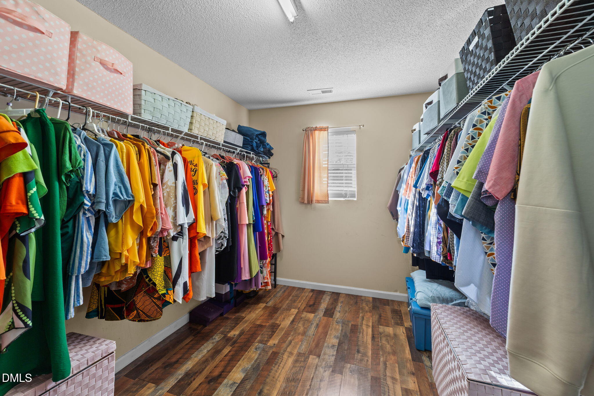 135 Oakton Ridge Place Garner, NC 27529 - Photo 27 of 40 a view of walk in closet with clothes
