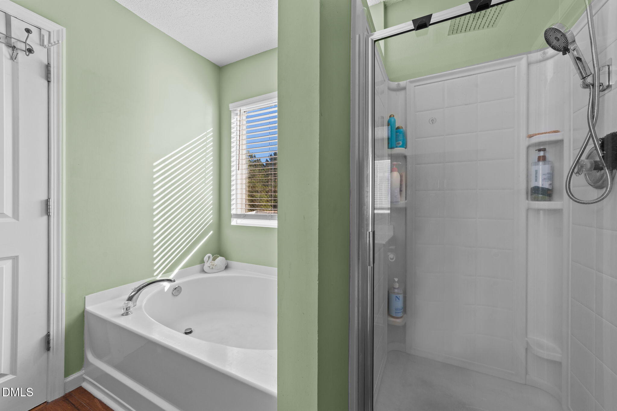 135 Oakton Ridge Place Garner, NC 27529 - Photo 29 of 40 a bathroom with a bathtub and shower