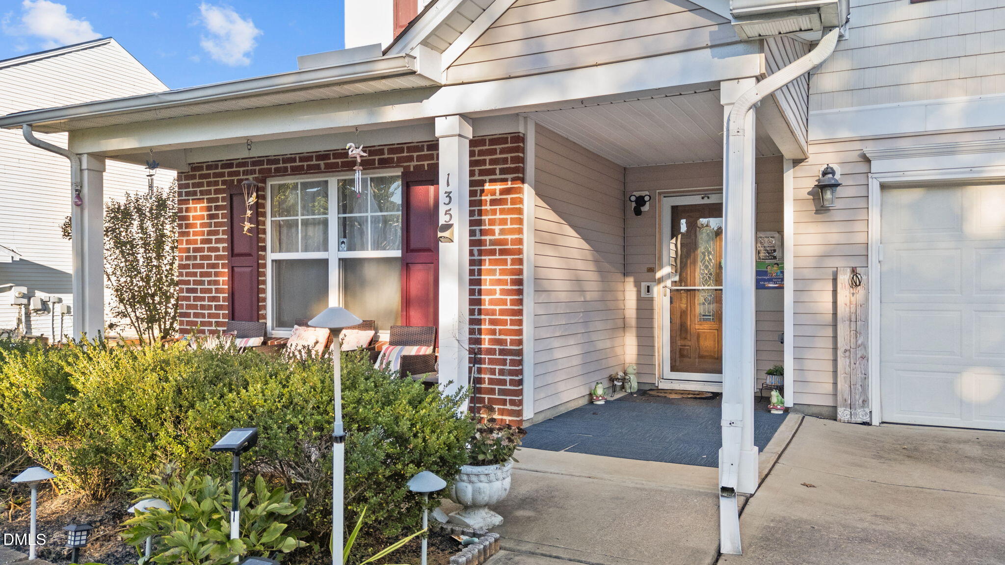 135 Oakton Ridge Place Garner, NC 27529 - Photo 2 of 40 a view of a porch with a door