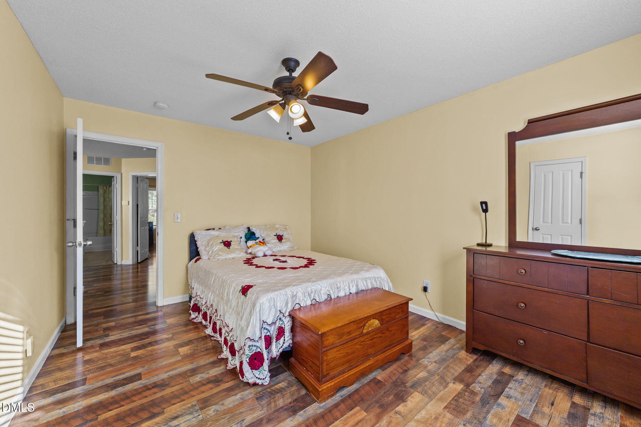 135 Oakton Ridge Place Garner, NC 27529 - Photo 32 of 40 a bedroom with a bed and a dresser