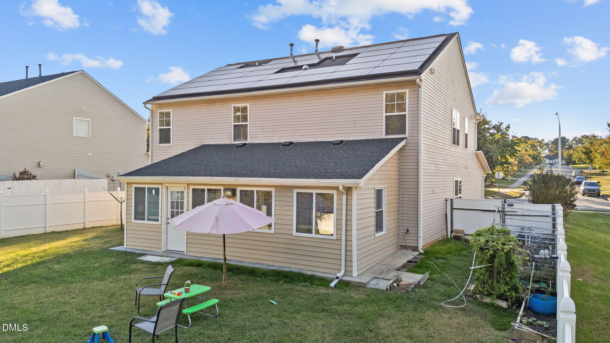 135 Oakton Ridge Place Garner, NC 27529 - Photo 34 of 40 a front view of a house with a yard and seating area
