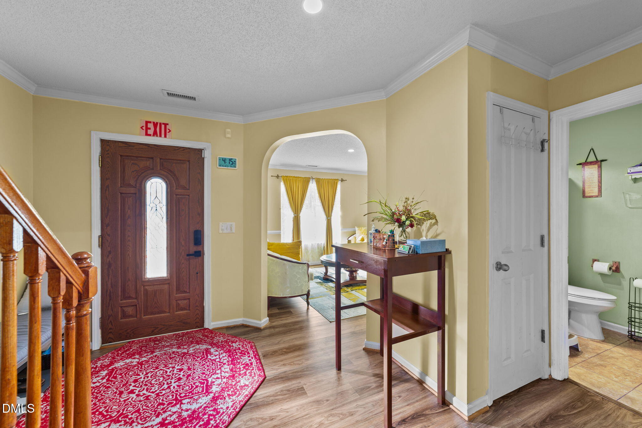 135 Oakton Ridge Place Garner, NC 27529 - Photo 3 of 40 a view of a hallway view with wooden floor and furniture