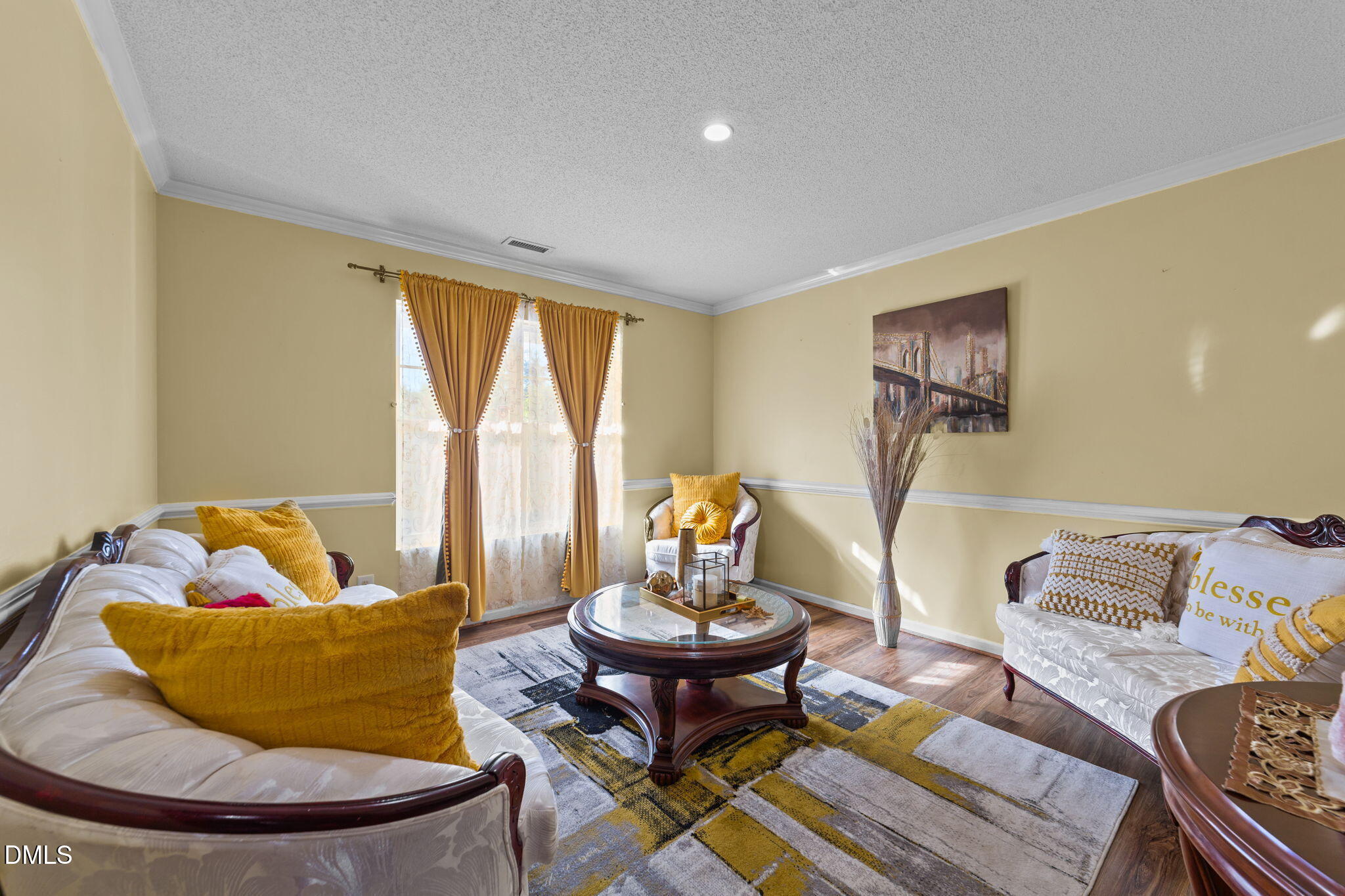 135 Oakton Ridge Place Garner, NC 27529 - Photo 4 of 40 a living room with furniture and a table