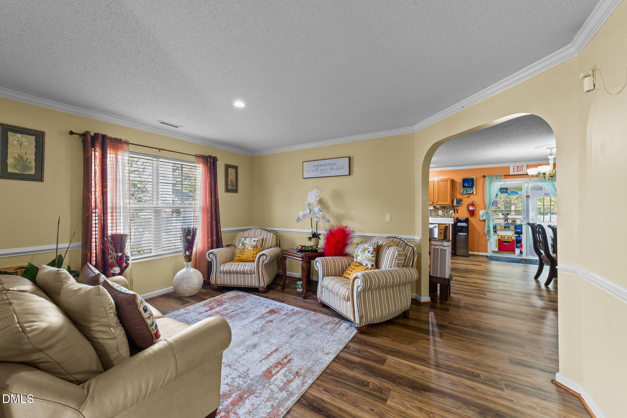 135 Oakton Ridge Place Garner, NC 27529 - Photo 6 of 40 a living room with furniture and a large window
