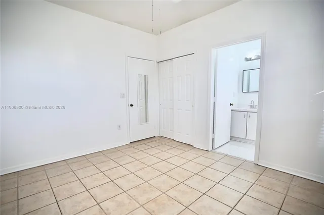 a view of a utility room with closet and natural light