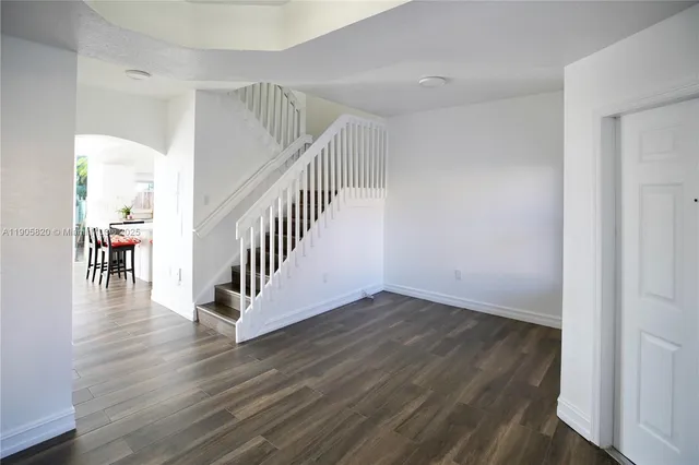 a view of entryway with wooden floor