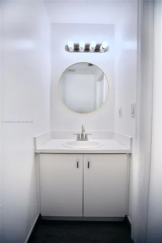 a bathroom with a sink and vanity