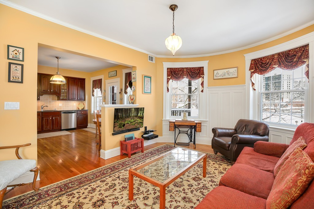 94 University Road, Unit 3 Brookline, MA 02446 - Photo 1 of 20 a living room with furniture and a flat screen tv