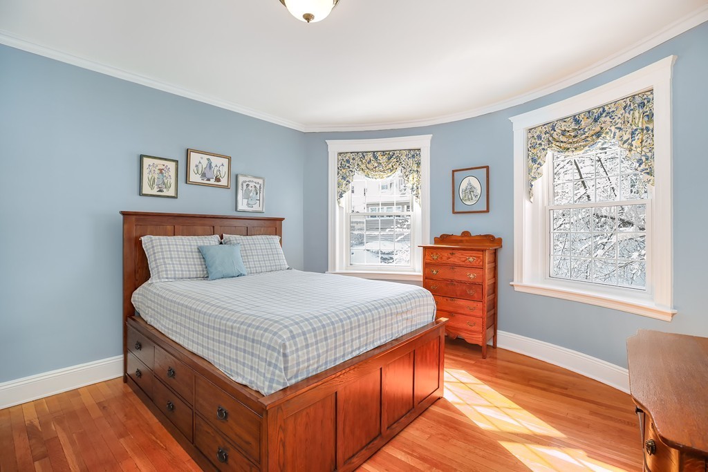 94 University Road, Unit 3 Brookline, MA 02446 - Photo 11 of 20 a bedroom with a bed and a window