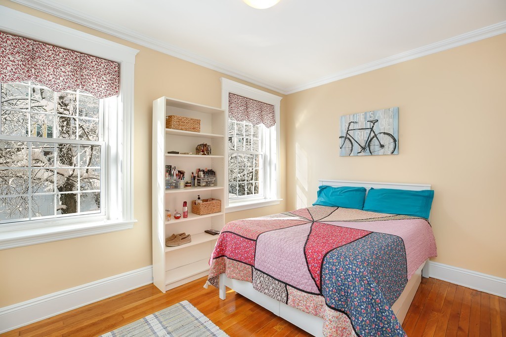 94 University Road, Unit 3 Brookline, MA 02446 - Photo 15 of 20 a bedroom with a bed and a window