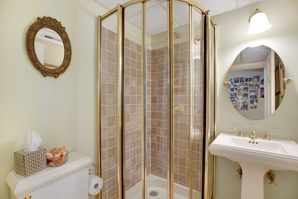 94 University Road, Unit 3 Brookline, MA 02446 - Photo 17 of 20 a bathroom with a sink and a mirror