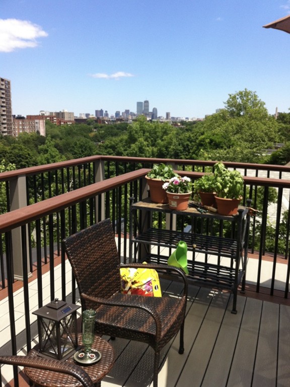 94 University Road, Unit 3 Brookline, MA 02446 - Photo 20 of 20 a view of a balcony with chairs