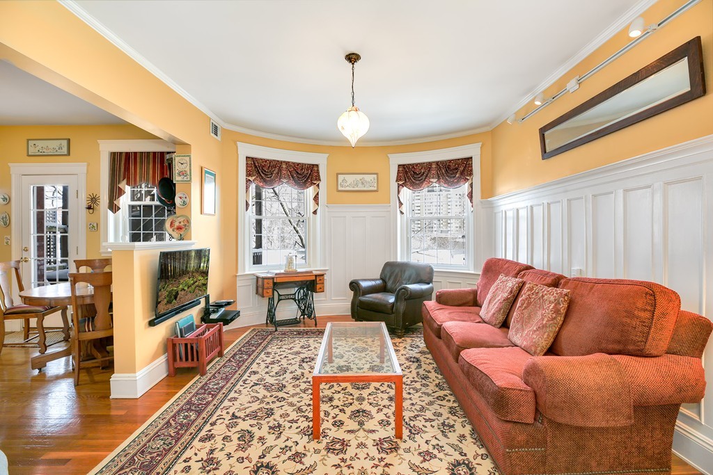 94 University Road, Unit 3 Brookline, MA 02446 - Photo 2 of 20 a living room with furniture ceiling fan and a rug