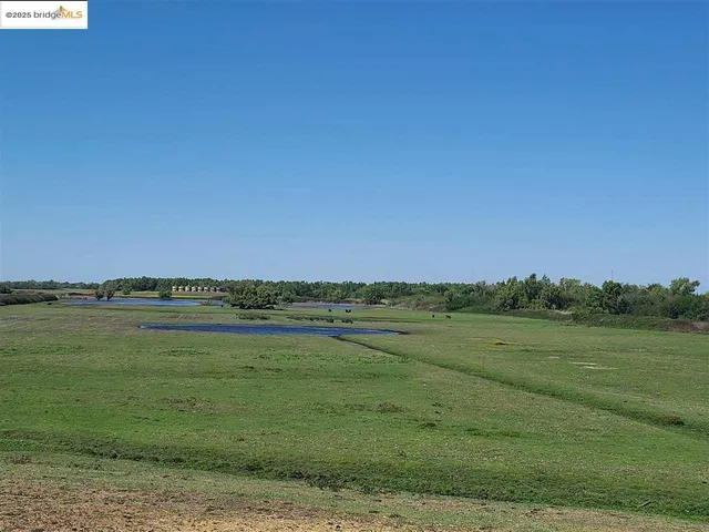 a view of an ocean and a mountain