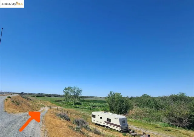 a view of a town with mountains in the background