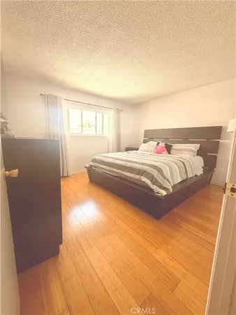 a bedroom with a bed and with view of bathroom