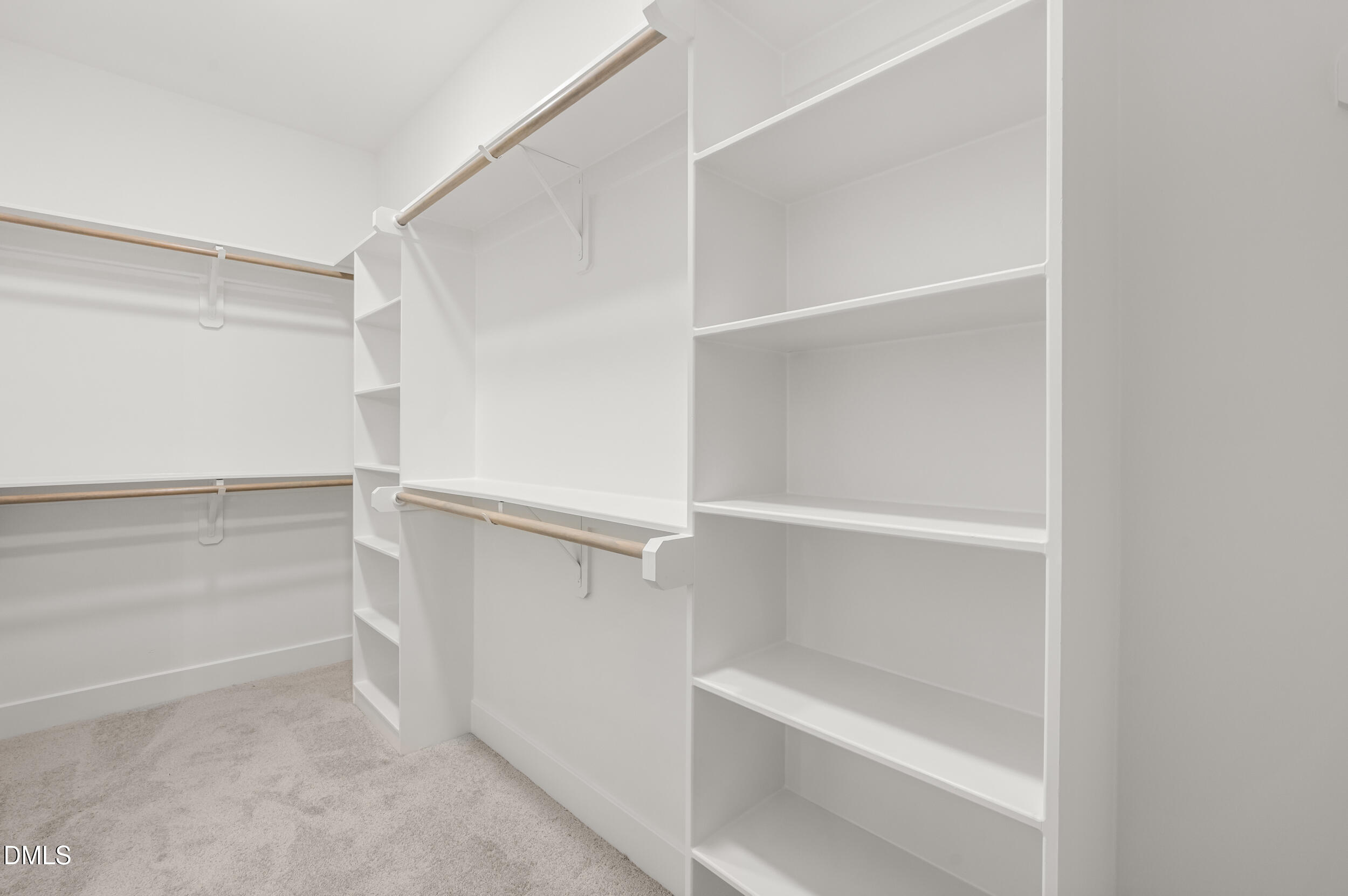 708 Grayhaven Place Raleigh, NC 27606 - Photo 18 of 33 a view of walk in closet with empty racks