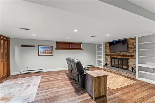 a living room with furniture and a fireplace