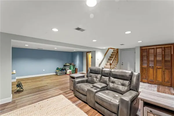 a living room with furniture and large window