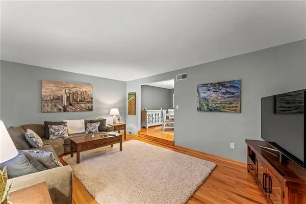 a living room with furniture and a rug