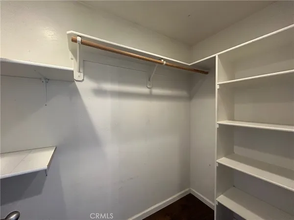 a view of an empty walk in closet