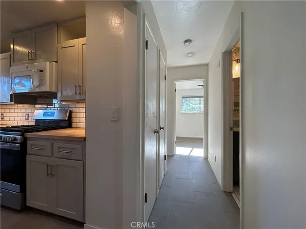 a view of hallway with cabinets