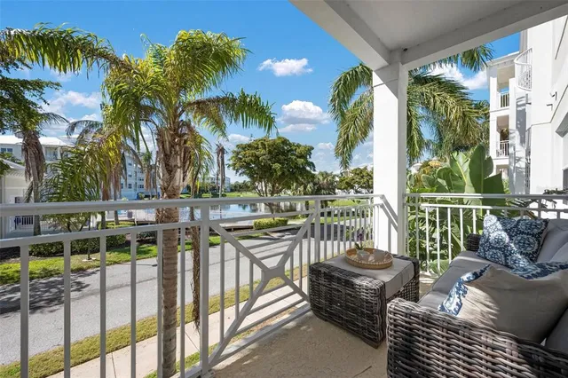 a view of a chairs and tables in the balcony