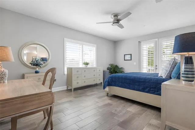 a living room with furniture a chandelier and a window