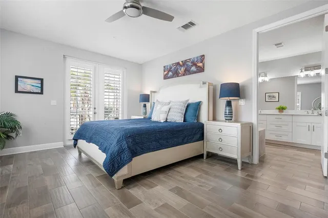 a spacious bedroom with a bed and a table