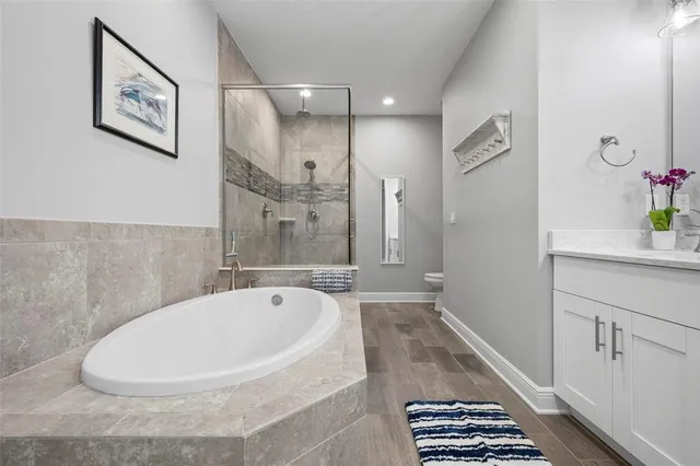 a bathroom with a bathtub and a shower