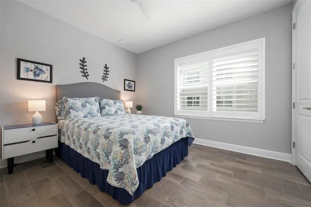 a spacious bedroom with a bed and a window