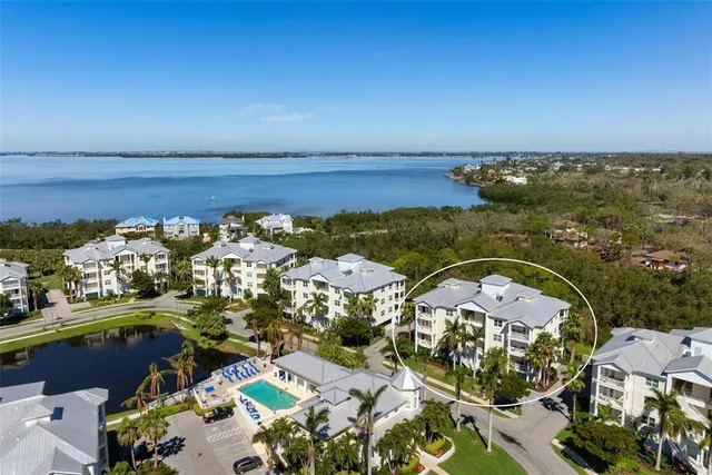 an aerial view of a house with a lake view