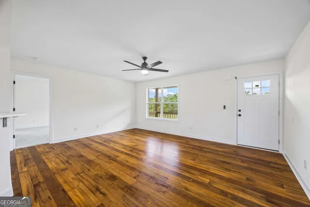 a view of a kitchen with wooden floor