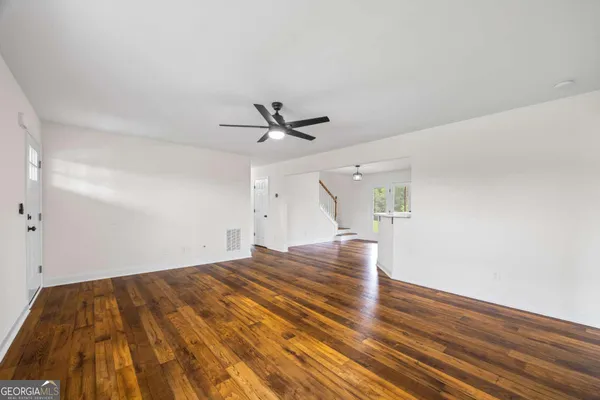 a kitchen with stainless steel appliances a stove refrigerator sink and microwave