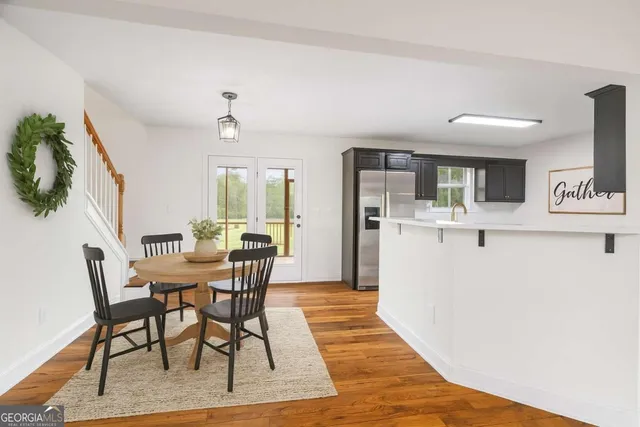 a kitchen with stainless steel appliances wooden cabinets and a stove top oven