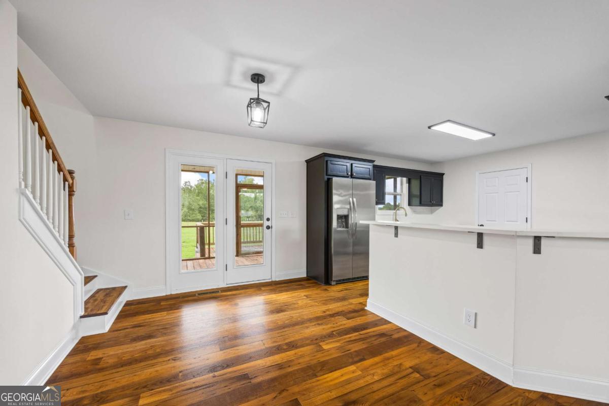 1718 Ed Bennett Road Nicholson, GA 30565 - Photo 24 of 70 a view of a kitchen with wooden floor