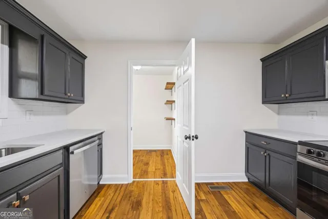 an empty room with a ceiling fan