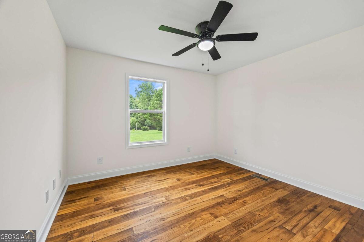 1718 Ed Bennett Road Nicholson, GA 30565 - Photo 41 of 70 an empty room with a window