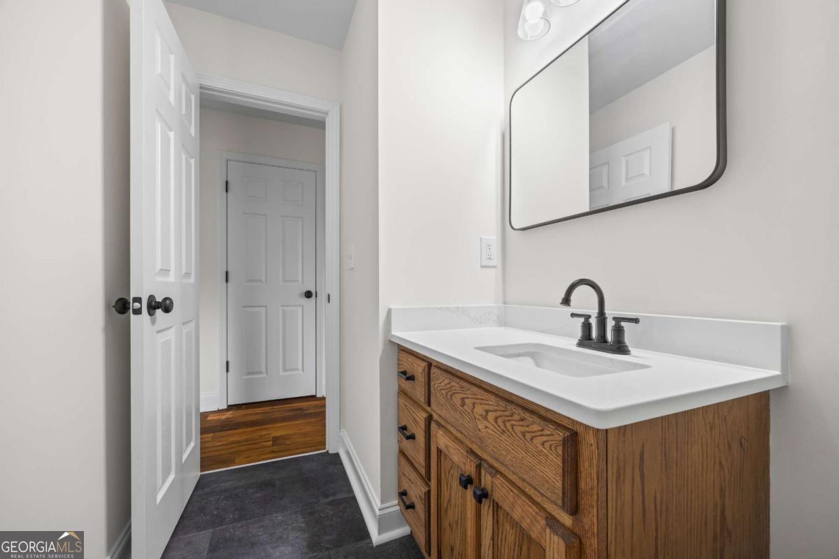 1718 Ed Bennett Road Nicholson, GA 30565 - Photo 46 of 71 a bathroom with a sink and a mirror