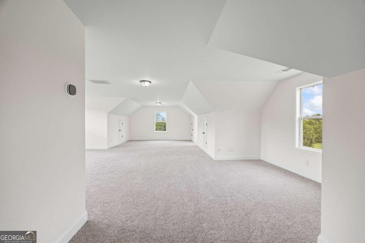 1718 Ed Bennett Road Nicholson, GA 30565 - Photo 49 of 70 an empty room with windows and entrance