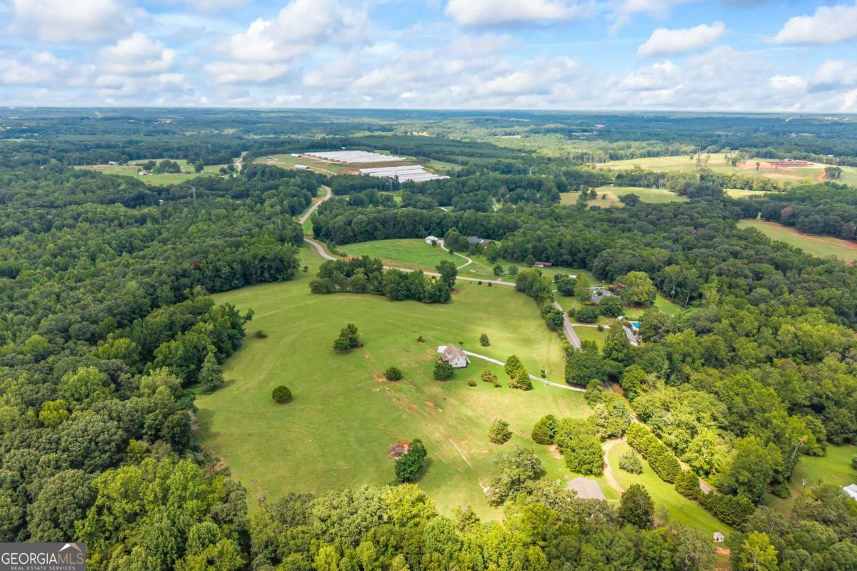 1718 Ed Bennett Road Nicholson, GA 30565 - Photo 6 of 70 a view of a lake with a city